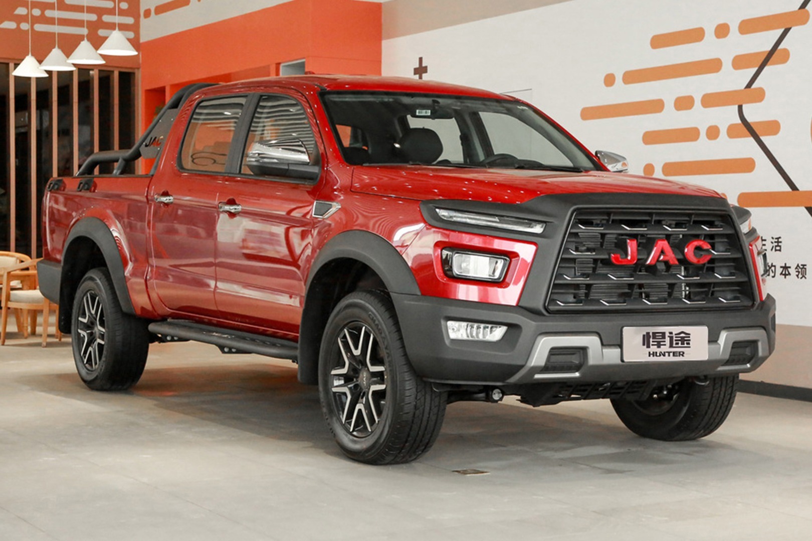 Red pickup truck with aggressive front design